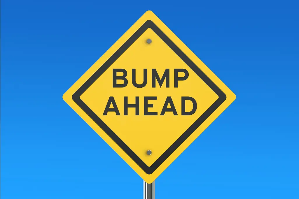 yeallow road sign "bump ahead"