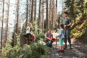 a family in the forest on a hike