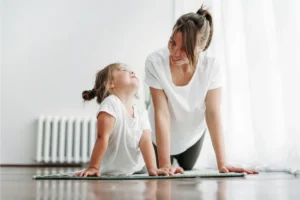 mum and daughter doing yoga