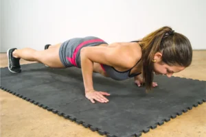 a woman doing a pushup