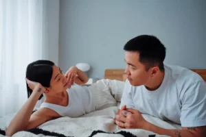 couple talking on the bed