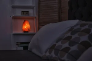 salt lamp on a shelve in a bedroom