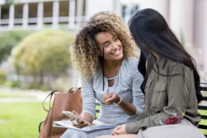 telling a friend + two women