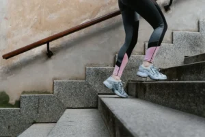 womans legs climbing steps